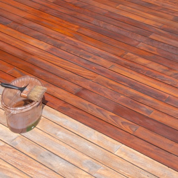 Wood,Deck,Oil,And,Paint,Brush,On,The,Bucket,,Exterior