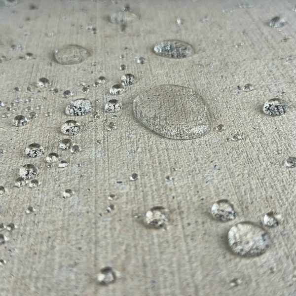 Close-up,Shot,Of,Water,Droplets,On,A,Concrete,Slab